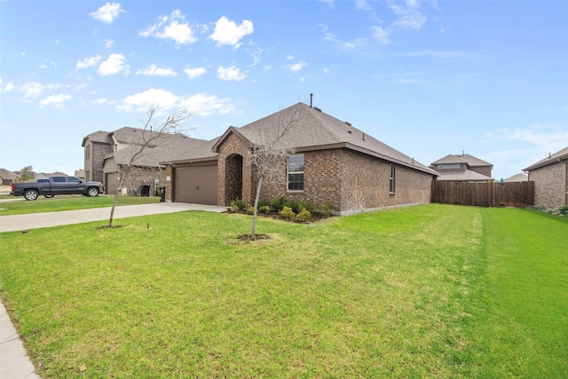 view of front of home featuring a garage and a front lawn