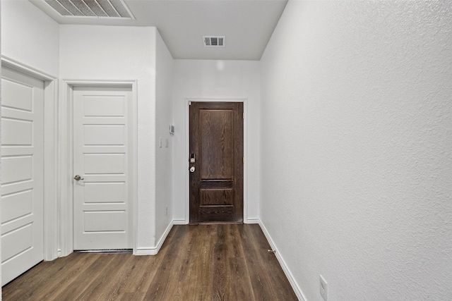 hall with dark wood-type flooring