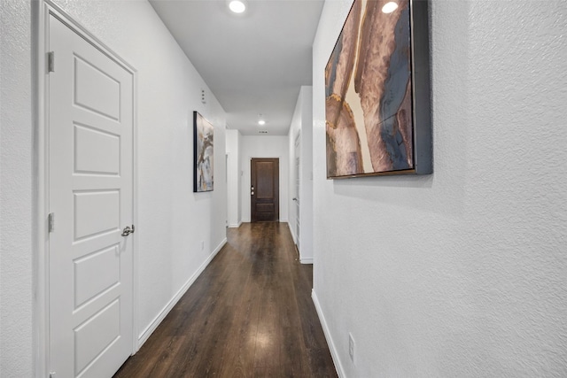 hall with dark hardwood / wood-style floors