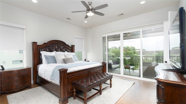 bedroom featuring ceiling fan, hardwood / wood-style flooring, and access to outside