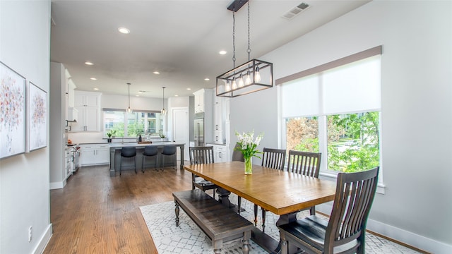 dining room with hardwood / wood-style flooring