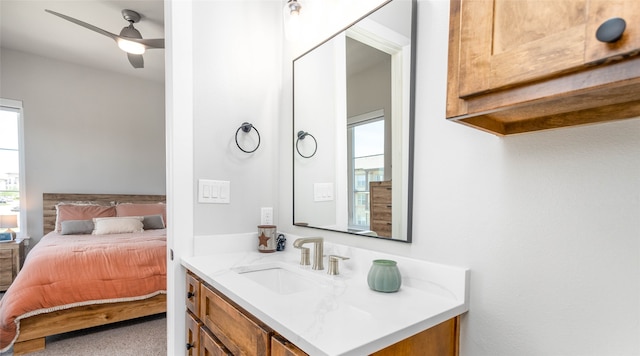 bathroom with ceiling fan and vanity