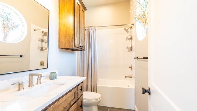 full bathroom featuring tile patterned floors, shower / bath combo, vanity, and toilet