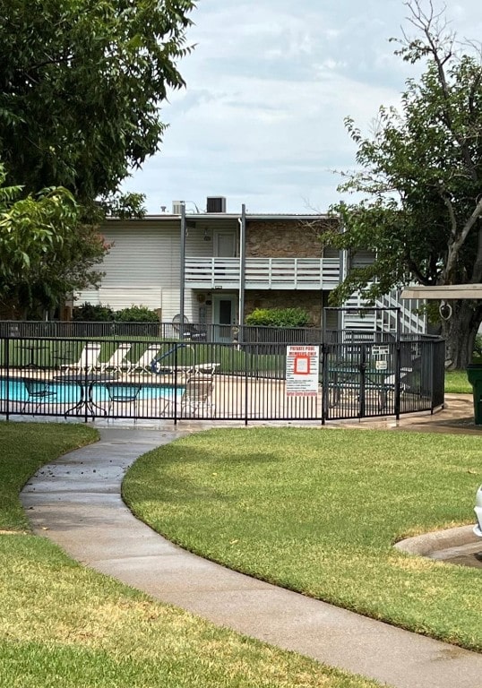 view of nearby features with a yard and a pool