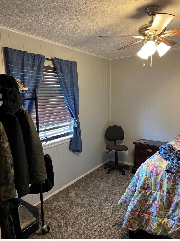 bedroom featuring a textured ceiling, ceiling fan, and carpet floors