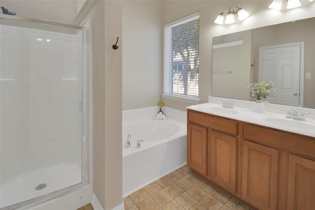 bathroom with vanity and separate shower and tub