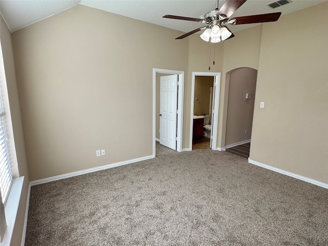 unfurnished room featuring ceiling fan, carpet floors, and high vaulted ceiling