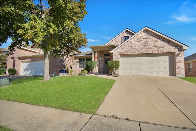 view of front of house featuring a garage and a front lawn