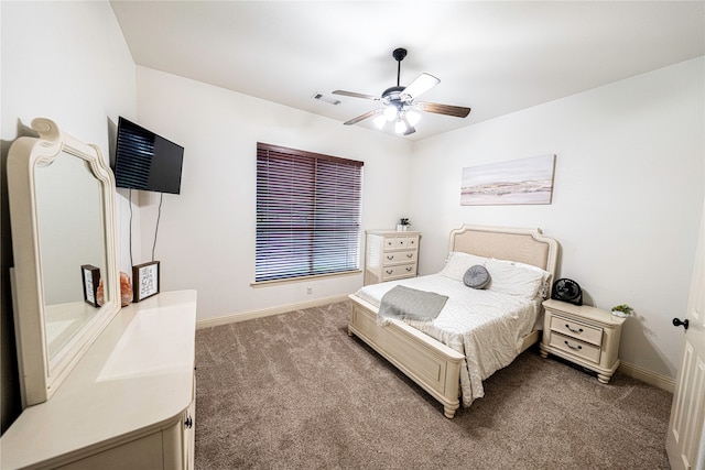 bedroom with dark carpet and ceiling fan