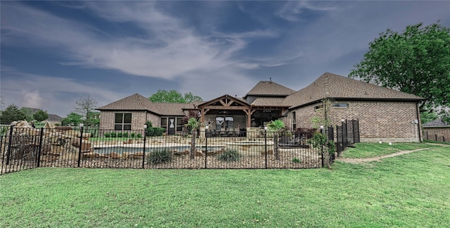 exterior space with a front lawn and a fenced in pool