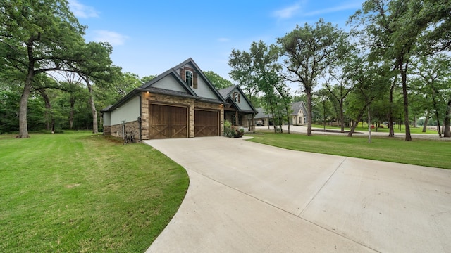 view of front of house featuring a garage and a front lawn