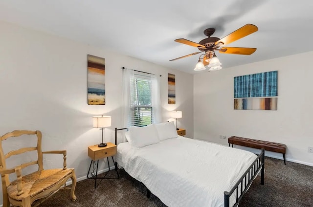 bedroom with dark colored carpet and ceiling fan