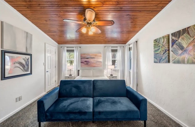 living room with wood ceiling, ceiling fan, and carpet floors