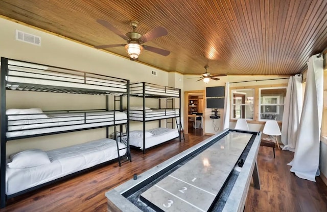 game room with ceiling fan, dark hardwood / wood-style floors, and wood ceiling