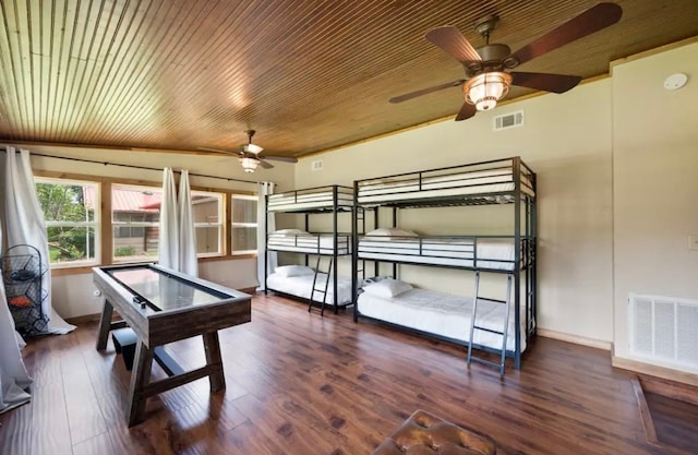 rec room featuring wood ceiling, ceiling fan, and dark wood-type flooring