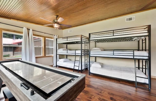 interior space with wooden ceiling, ceiling fan, and dark wood-type flooring