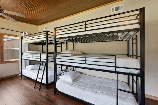 bedroom with crown molding, wooden ceiling, ceiling fan, and hardwood / wood-style floors