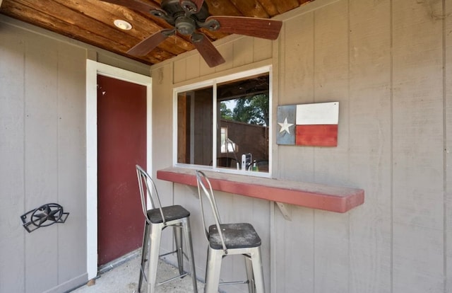 exterior space with ceiling fan