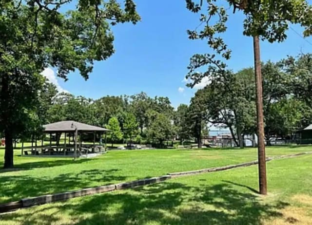 view of property's community with a yard and a gazebo