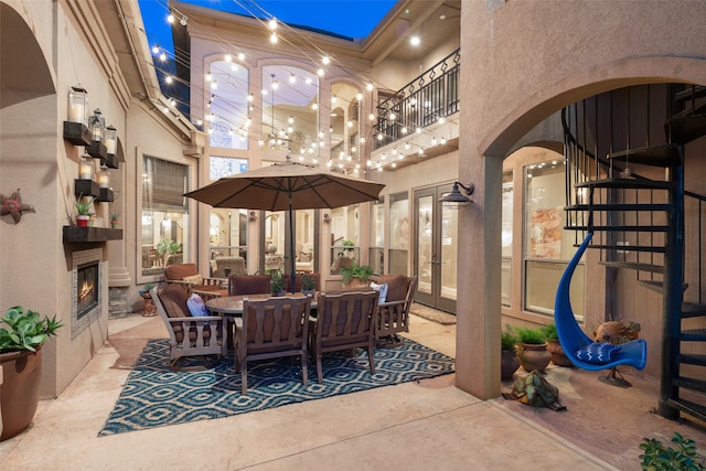 view of patio featuring an outdoor fireplace