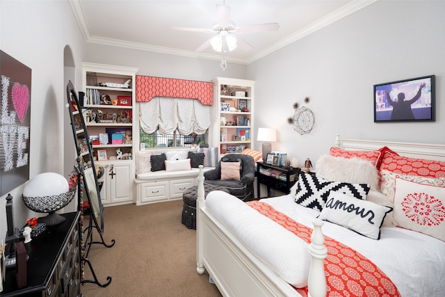 carpeted bedroom with ceiling fan and crown molding