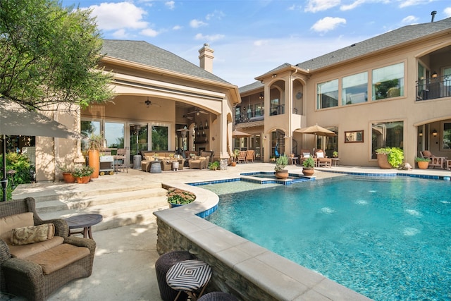 view of swimming pool with an in ground hot tub, an outdoor hangout area, ceiling fan, and a patio area