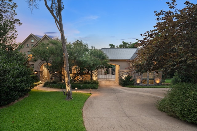 view of front of home with a yard