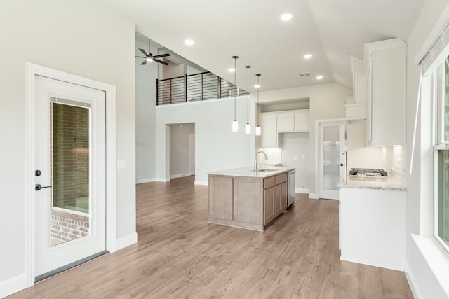 bathroom featuring tile flooring, double vanity, and shower with separate bathtub