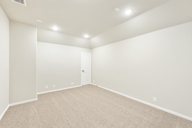 unfurnished bedroom featuring light colored carpet, ceiling fan, and ensuite bathroom