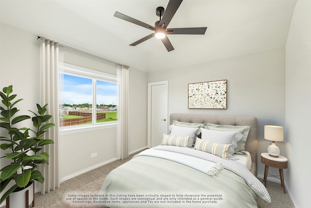 bedroom with ceiling fan and carpet