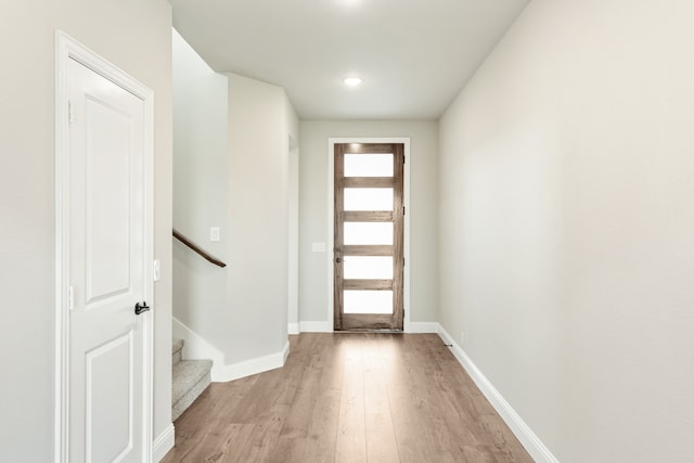 entrance foyer with a wealth of natural light and hardwood / wood-style floors