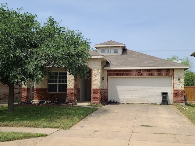 view of front of property featuring a garage and a front yard