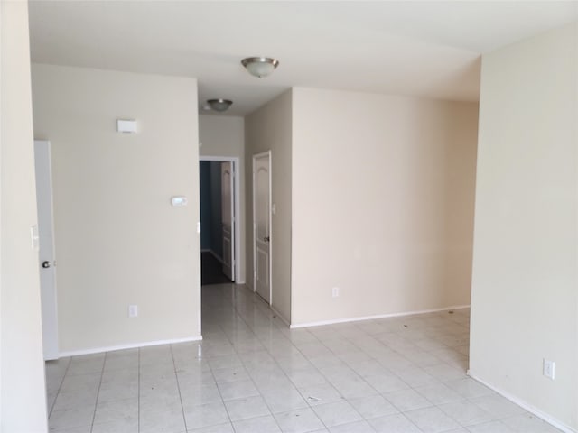 spare room featuring light tile floors