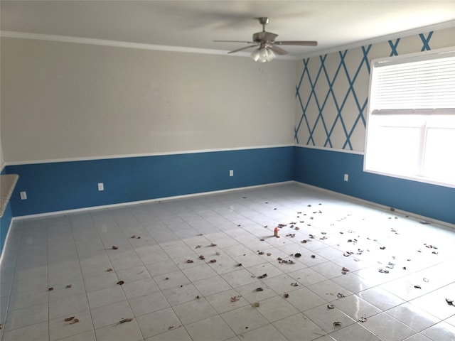 tiled spare room featuring ceiling fan