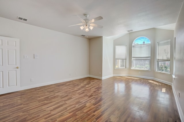 spare room featuring wood-type flooring and ceiling fan