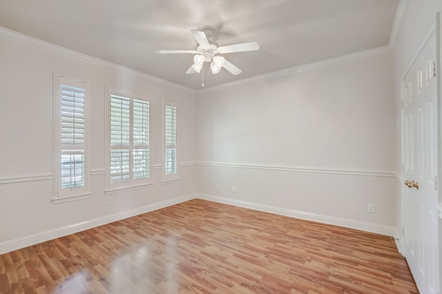 spare room featuring light hardwood / wood-style flooring, ceiling fan, and ornamental molding