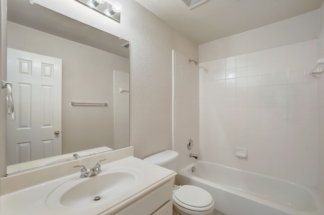 full bathroom featuring vanity, toilet, and tiled shower / bath