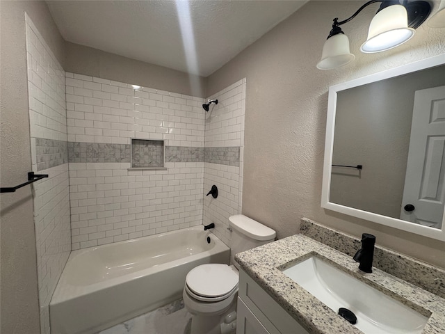 full bathroom with tiled shower / bath, vanity, and toilet