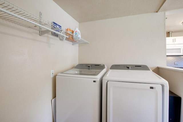 laundry room with independent washer and dryer