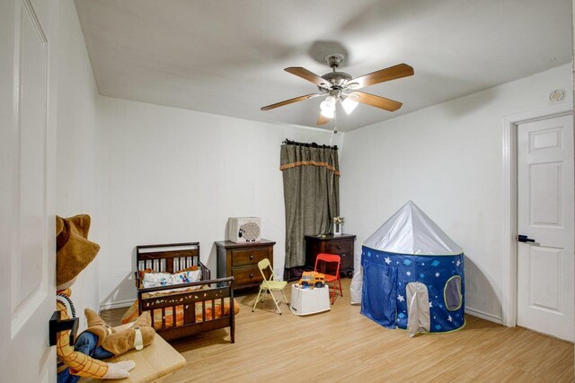 interior space with light hardwood / wood-style flooring and ceiling fan