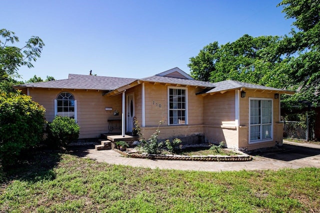 ranch-style house with a front yard