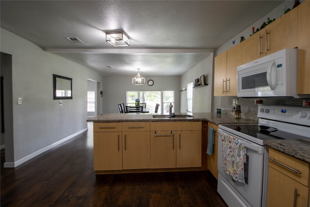 kitchen with sink, white appliances, kitchen peninsula, and dark hardwood / wood-style floors