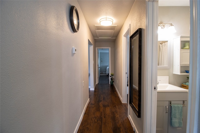 hallway featuring dark hardwood / wood-style floors