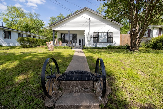 rear view of house with a lawn