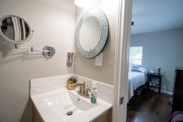 bathroom featuring wood-type flooring and sink