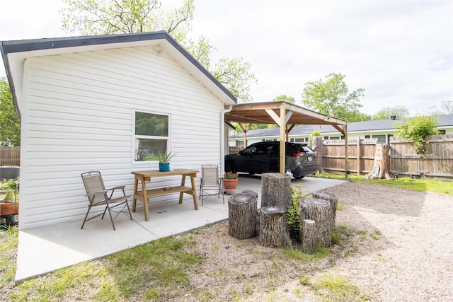 view of patio featuring a carport