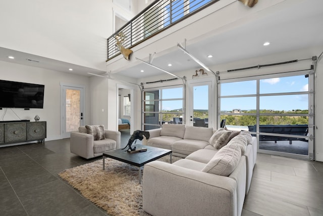 living room featuring a high ceiling