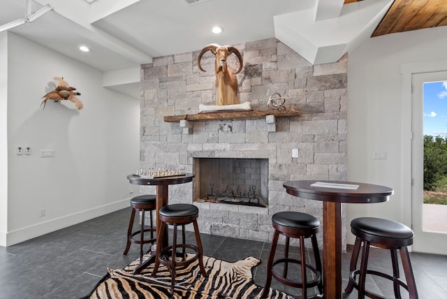 interior space featuring a stone fireplace