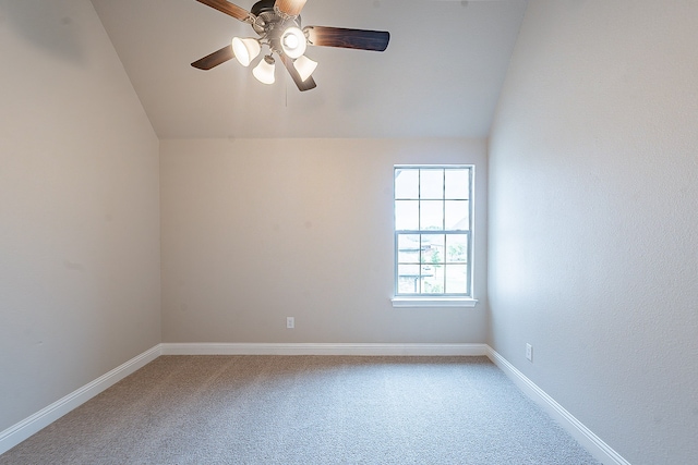 carpeted empty room featuring lofted ceiling and ceiling fan