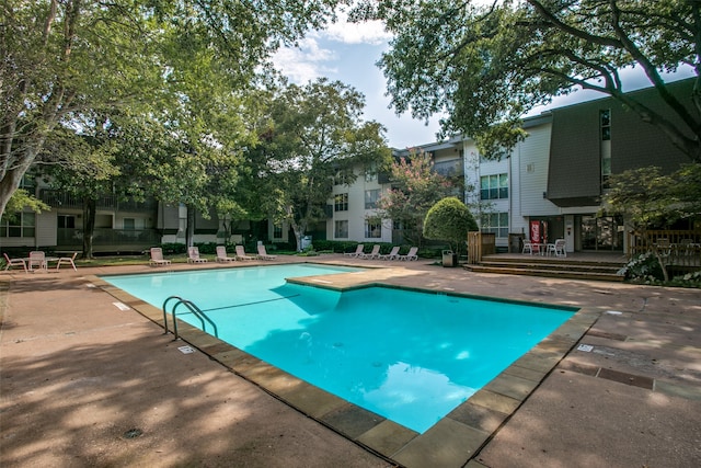 view of pool featuring a patio area